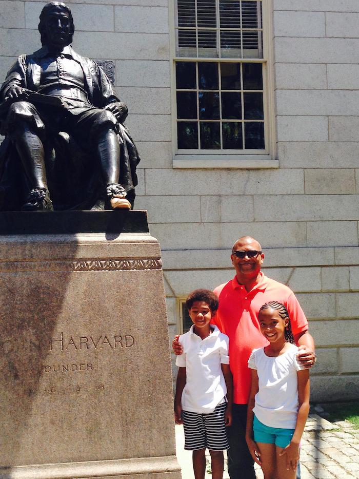 Reggie w/children at Harvard statue